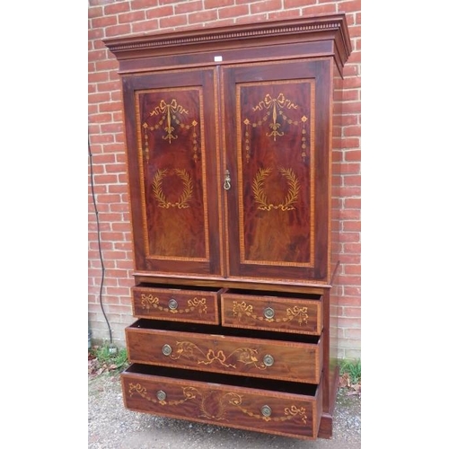 720 - A 19th century mahogany Sheraton Revival linen press, the dentil cornice above marquetry inlaid door... 