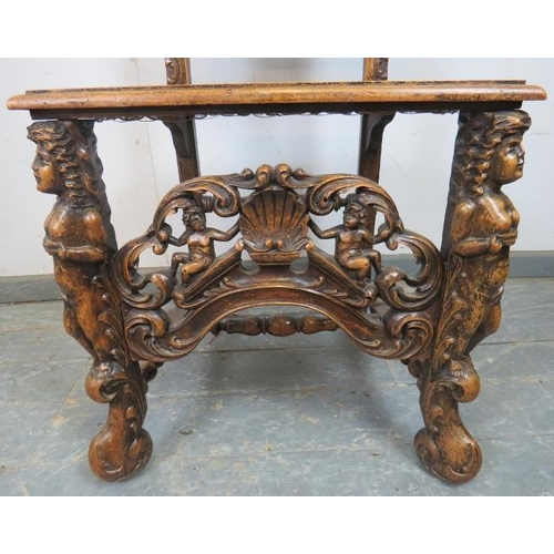 722 - A pair of 19th century fruitwood high back bergère hall chairs in the Carolean taste, the carved and... 