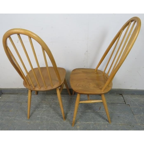 723 - A set of four mid-century blonde elm and beech Windsor Quaker dining chairs by Ercol (model 365) on ... 