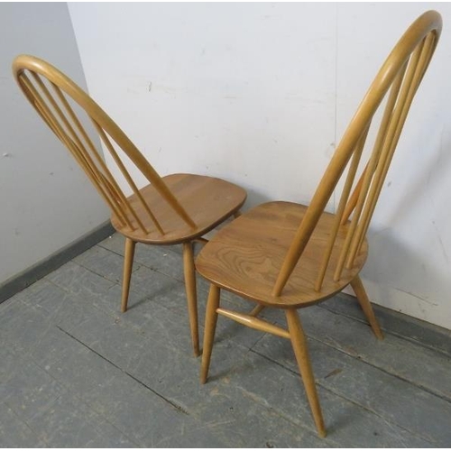 723 - A set of four mid-century blonde elm and beech Windsor Quaker dining chairs by Ercol (model 365) on ... 