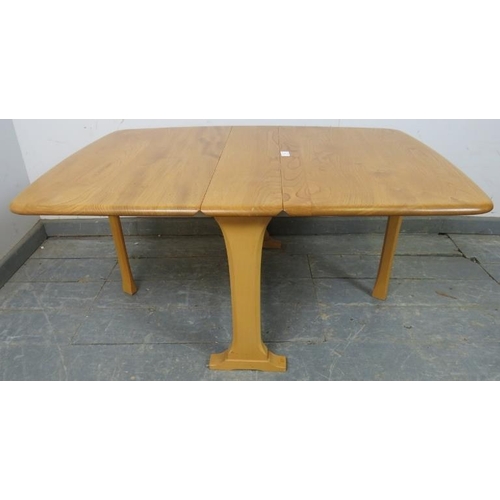 725 - A vintage blonde elm and beech drop-leaf Sutherland/coffee table by Ercol (model 820) on splayed sup... 