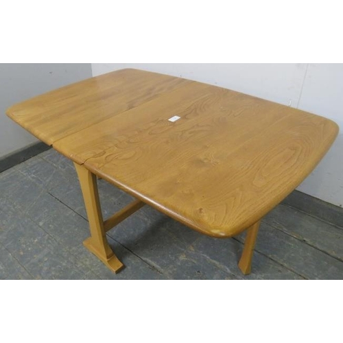 725 - A vintage blonde elm and beech drop-leaf Sutherland/coffee table by Ercol (model 820) on splayed sup... 