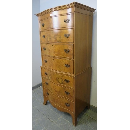 731 - A reproduction serpentine fronted burr walnut chest on chest in the Georgian taste, having seven gra... 