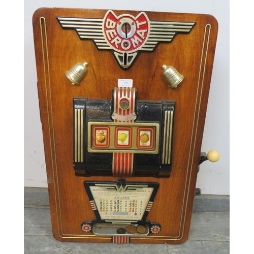 737 - A vintage German ‘Beromat’ one-armed bandit penny slot machine, within a walnut case. Includes coins... 