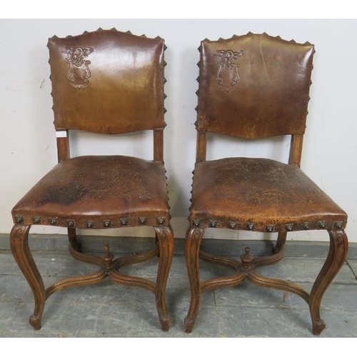 742 - A pair of 19th century walnut Continental side chairs, upholstered in tobacco brown embossed leather... 