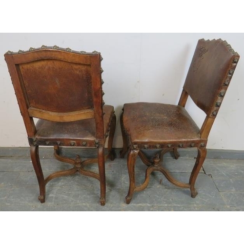 742 - A pair of 19th century walnut Continental side chairs, upholstered in tobacco brown embossed leather... 