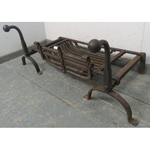 747 - A heavy, well-made Gothic style wrought iron fire basket and fire dogs with ball finials, on splayed... 