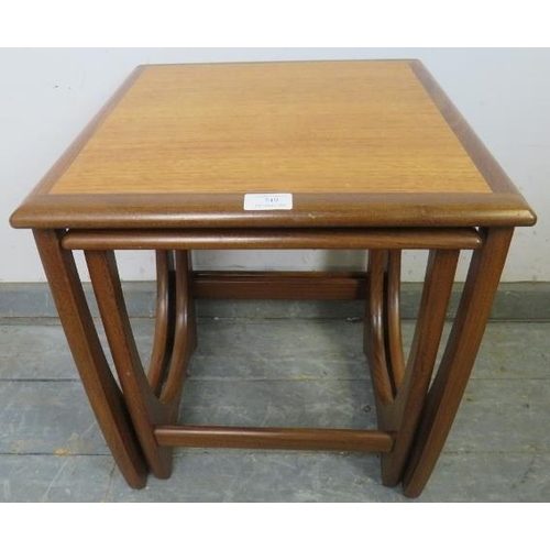 749 - Two mid-century teak ‘astro’ nesting tables by G-Plan, the crossbanded tops on curved supports with ... 