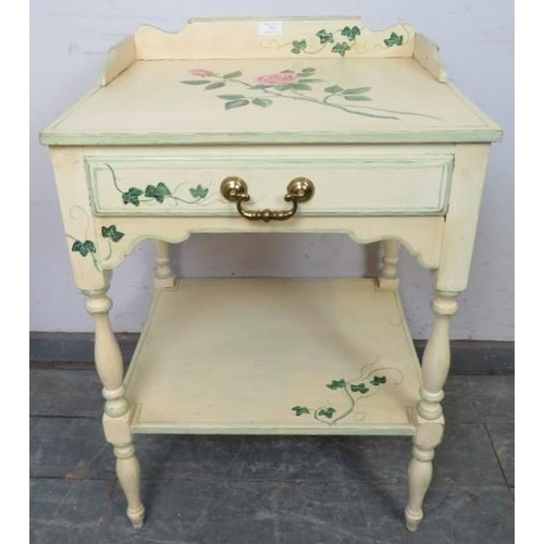 752 - A solid oak two tier side table by Whitney furniture, hand-painted with floral motifs, the ¾ gallery... 