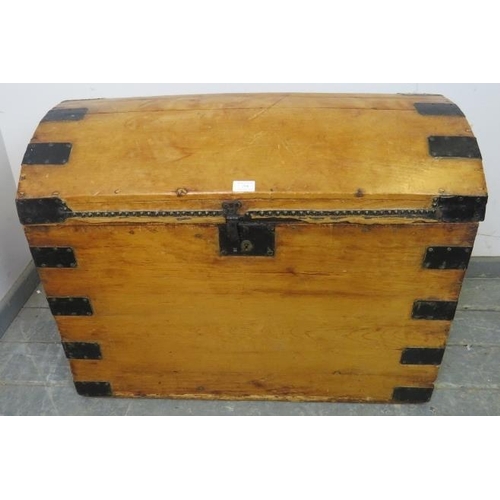 754 - An antique pine dome topped trunk by James Northam of Exeter, having cast iron lock, leather bound s... 