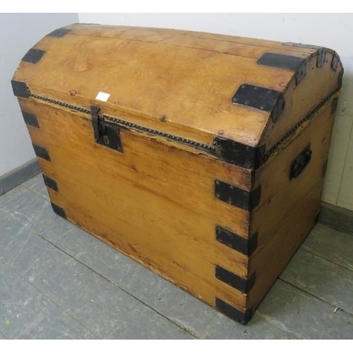 754 - An antique pine dome topped trunk by James Northam of Exeter, having cast iron lock, leather bound s... 