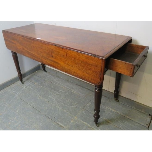 757 - An early 19th century mahogany Pembroke table of exceptionally long proportions, having single drawe... 