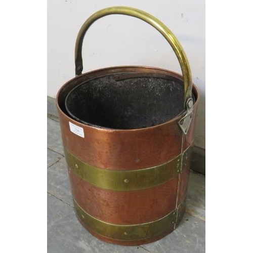 758 - An Arts & Crafts Period planished copper coal/log   bucket, with brass coopered and riveted banding ... 