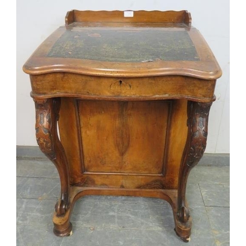 759 - A Victorian burr walnut Davenport, having ¾ gallery, the rising lid revealing a sycamore lined fitte... 