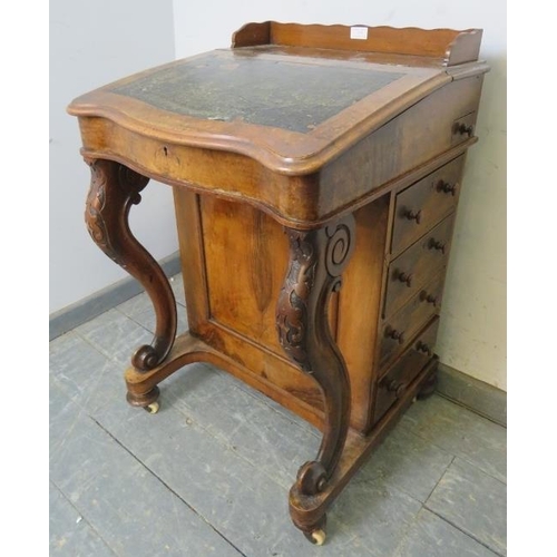 759 - A Victorian burr walnut Davenport, having ¾ gallery, the rising lid revealing a sycamore lined fitte... 