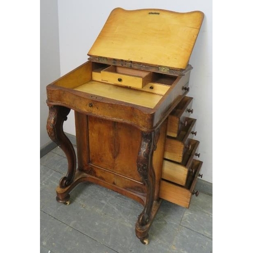 759 - A Victorian burr walnut Davenport, having ¾ gallery, the rising lid revealing a sycamore lined fitte... 