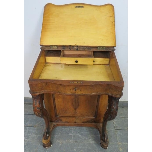 759 - A Victorian burr walnut Davenport, having ¾ gallery, the rising lid revealing a sycamore lined fitte... 