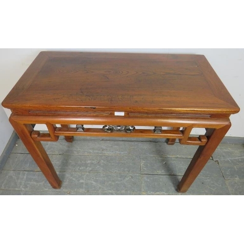 763 - A vintage Chinese elm altar table in the 18th century style, having carved and pierced fretwork frie... 