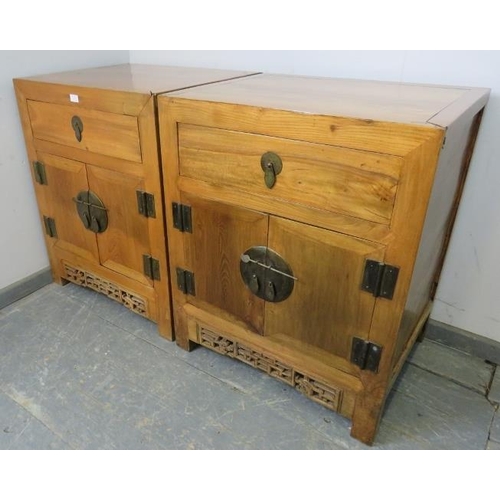 764 - A pair of vintage light elm Chinese side cabinets, each with one long drawer above double doors with... 