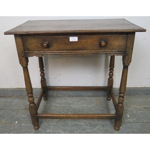 769 - A vintage oak side table in the 18th century taste, having one long drawer with turned wooden handle... 