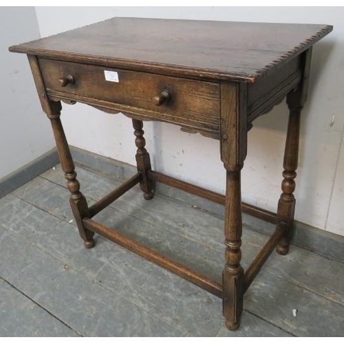 769 - A vintage oak side table in the 18th century taste, having one long drawer with turned wooden handle... 