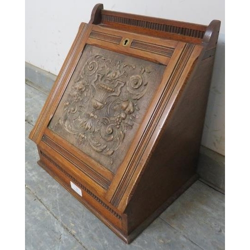 780 - A turn of the century mahogany stationary box, the lid relief carved with Neo classical motifs, open... 