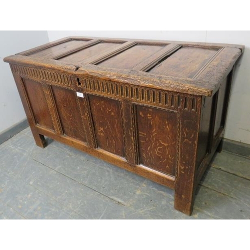 785 - A late 17th/early 18th century oak panelled coffer of good colour, with chip carved frieze and panel... 