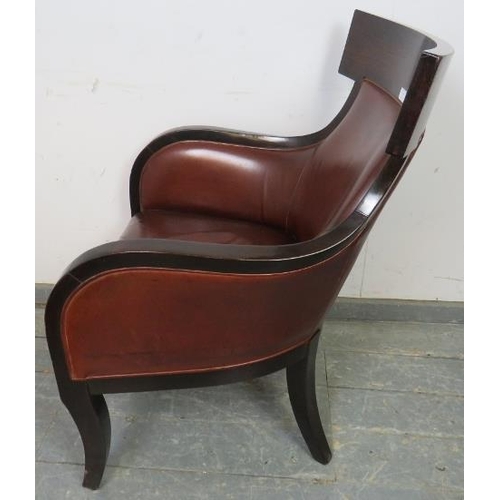 787 - A contemporary fruitwood armchair in the French Empire style, upholstered in supple tobacco brown le... 