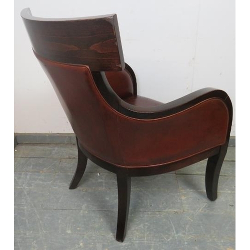 787 - A contemporary fruitwood armchair in the French Empire style, upholstered in supple tobacco brown le... 