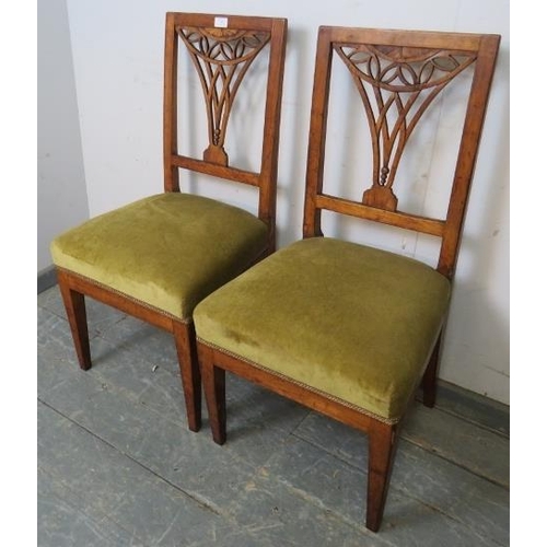 788 - A pair of Georgian fruitwood side chairs, the pierced backs with batwing inlay, on tapered square su... 