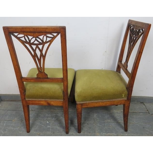 788 - A pair of Georgian fruitwood side chairs, the pierced backs with batwing inlay, on tapered square su... 