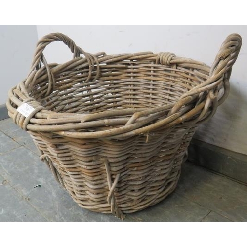 793 - A vintage wicker twin-handled woven fruit picker’s/log basket. 
H42cm Diameter 50cm (approx).
Condit... 