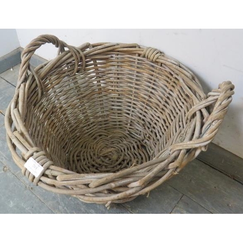 793 - A vintage wicker twin-handled woven fruit picker’s/log basket. 
H42cm Diameter 50cm (approx).
Condit... 