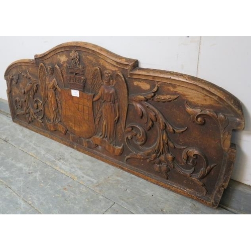 799 - A 19th century fruitwood Continental wall mounting plaque, depicting the Wards family crest in high ... 