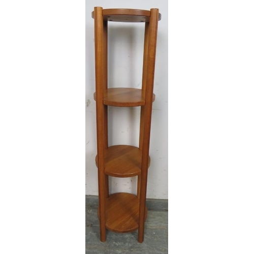 810 - A mid-century Danish teak four-tier circular whatnot, on cylindrical reeded supports. 
H120cm Diamet... 