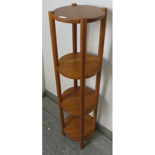 810 - A mid-century Danish teak four-tier circular whatnot, on cylindrical reeded supports. 
H120cm Diamet... 