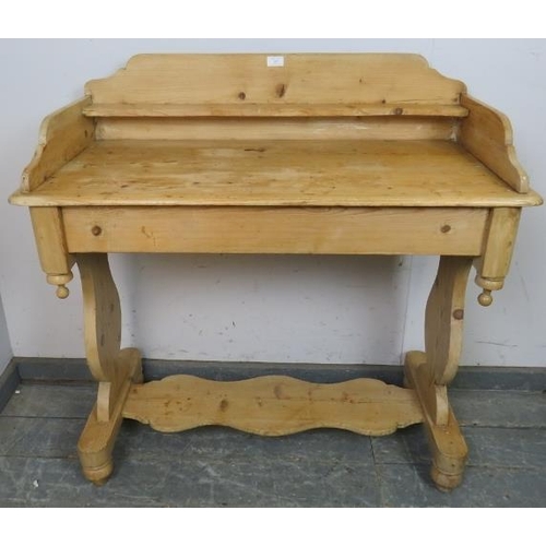 817 - An antique stripped pine washstand, having a shelved ¾ gallery with hand-painted floral decoration t... 