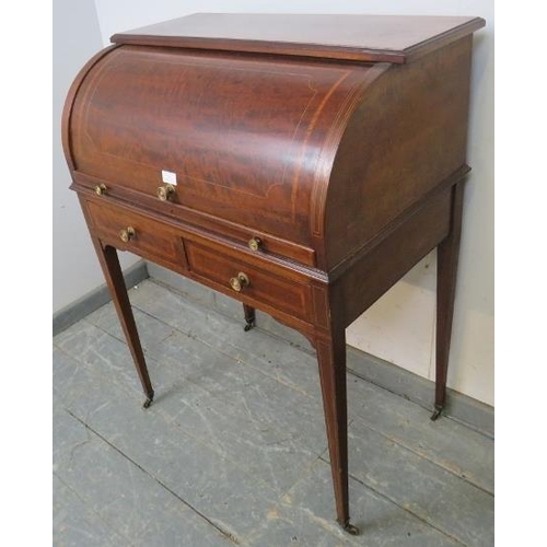 820 - An Edwardian mahogany cylinder writing desk, decorated with satinwood banding & boxwood strung, fitt... 