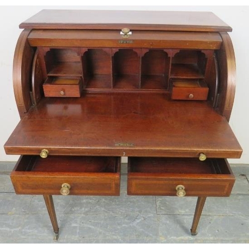 820 - An Edwardian mahogany cylinder writing desk, decorated with satinwood banding & boxwood strung, fitt... 