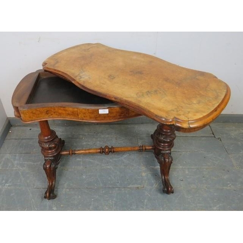 823 - A Victorian figural walnut card table, the serpentine rectangular top with inverted rounded corners,... 