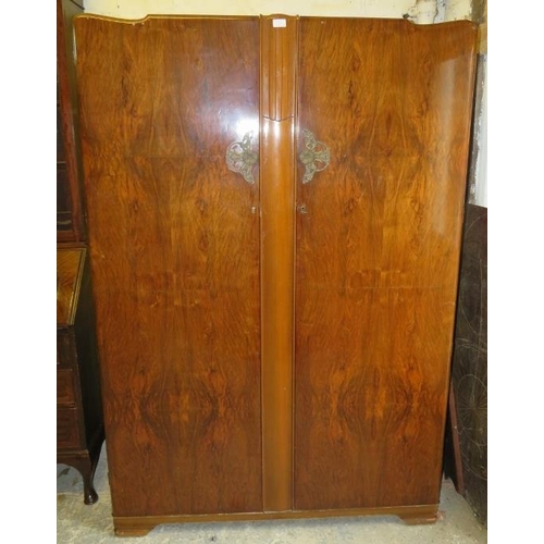 826 - An Art Deco Period burr walnut double wardrobe by Lebus, having fancy cast metal handles, the twin d... 