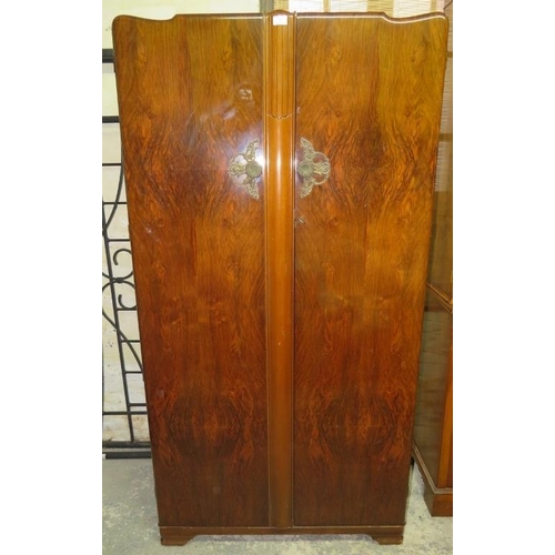 827 - An Art Deco Period burr walnut double wardrobe by Lebus, the twin doors opening onto a fitted interi... 