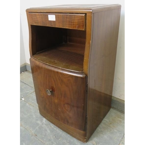 828 - An Art Deco Period bedside cabinet by Lebus, the blind frieze drawer above an open shelf, with cabin... 