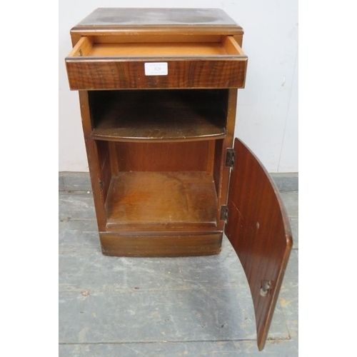 828 - An Art Deco Period bedside cabinet by Lebus, the blind frieze drawer above an open shelf, with cabin... 