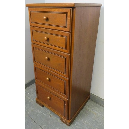 832 - A vintage narrow teak chest of five graduated drawers with turned wooden knob handles, on a plinth b... 