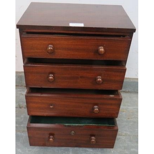 851 - A well-made 19th century mahogany chest of diminutive proportions, housing four oak-lined long drawe... 