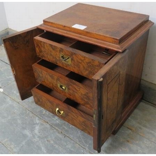 852 - A Victorian figured walnut table top cabinet, the twin doors with ebony and satinwood inlay, opening... 