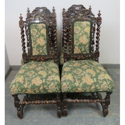 861 - A set of four 19th century Carolean Revival carved oak dining chairs, with busy foliate decoration, ... 