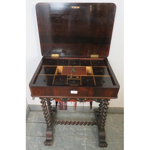 862 - A Victorian rosewood worktable, the top opening to reveal a fitted interior housing an array of lidd... 