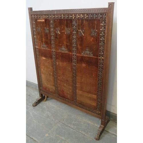 873 - A large 19th century mahogany firescreen, with chip carved frieze, the antique velvet panel with rep... 